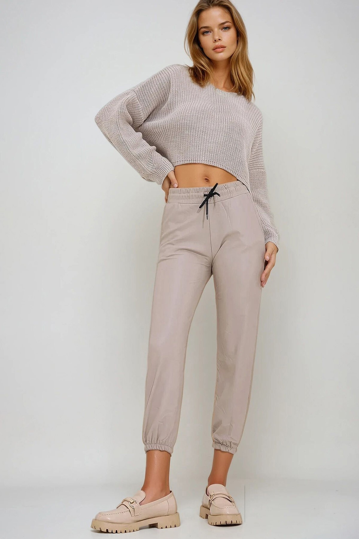 Bej Çift Cepli Bel Ve Bilek Lastikli İçi Şardonlu Casual Suni Deri Pantolon