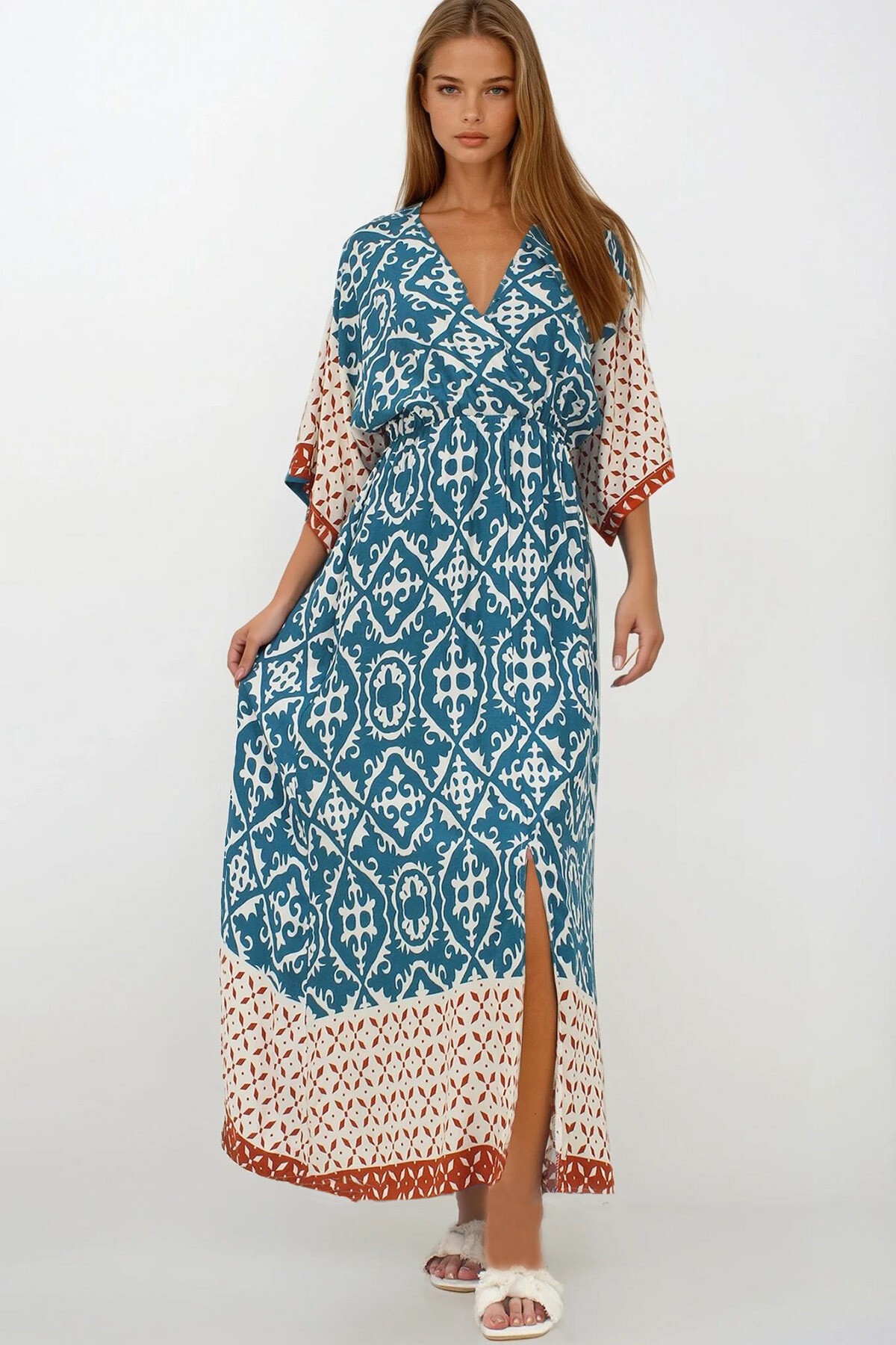 İndigo Kruvaze Yaka Beli Lastikli Yarasa Kol Yırtmaç Detaylı Dokuma Maxi Boy Elbise