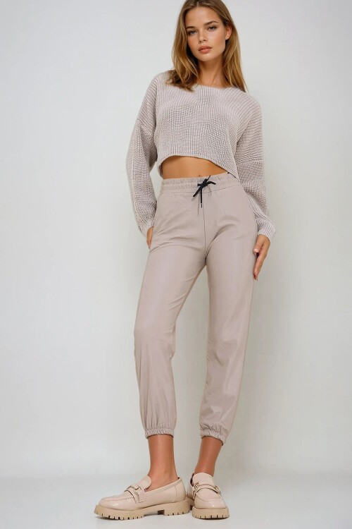 Bej Çift Cepli Bel Ve Bilek Lastikli İçi Şardonlu Casual Suni Deri Pantolon