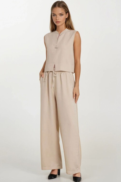 Bej Hakim Yaka Aksesuar Kapamalı Bluz Ve Bağcıklı Palazzo Pantolon Takım