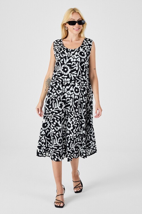 Siyah-Beyaz U Yaka Kolsuz Eteği Asimetrik Kesim Desenli Midi Boy Elbise