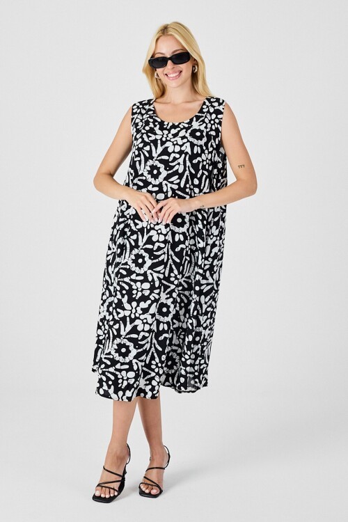 Siyah-Beyaz U Yaka Kolsuz Eteği Asimetrik Kesim Desenli Midi Boy Elbise