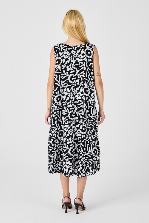 Siyah-Beyaz U Yaka Kolsuz Eteği Asimetrik Kesim Desenli Midi Boy Elbise